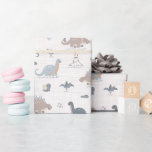 Papel De Presente Menino Bonito Dinossauro Dino Padrão de Chá Azul<br><div class="desc">Celebre a chegada de um pequeno com o nosso Livro de Enfeites Dinossauro Dino Cute Baby Boy! Apresentando dinos adoráveis em tons de azul, bronzeado e marrom, este padrão brincalhão é perfeito para embrulhar presentes em um chá de fraldas. Com suas criaturas pré-históricas encantadoras e cores suaves, ele adiciona um...</div>