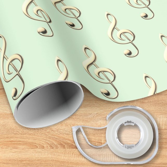 Papel De Presente Símbolo Musical da Clef Treble Música Verde do Lov (A music themed roll of gift wrapping paper, in light green with pattern of faux gold treble clefs)