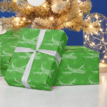 Papel De Presente Snowflake Airliner -<br><div class="desc">Lots of beautiful snowflakes cluster together to from an airliner on green with more green snowflakes.</div>