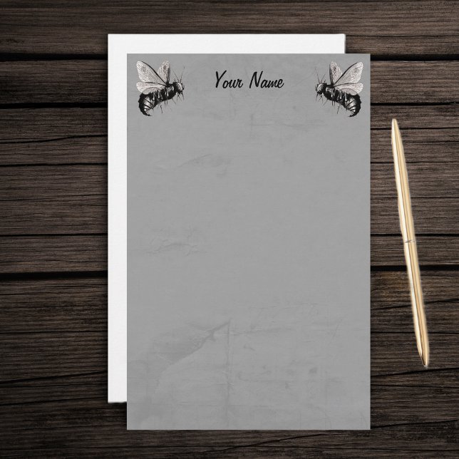 Papelaria Duas Ilustrações de Abelhas Góticas com Asas Crâni (Two spooky black white bees skull wings on grey marbled writing stationery paper.)