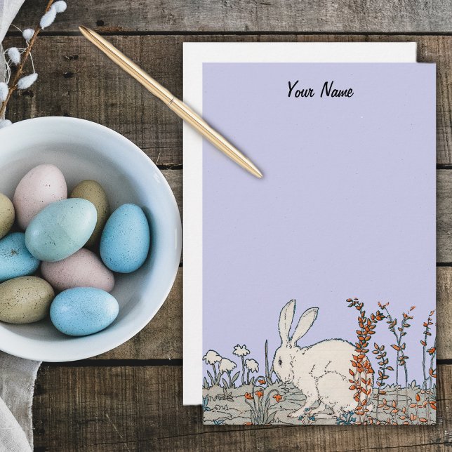 Papelaria Elegante Vintage Coelho Branco (White fluffy rabbit sitting on ground surrounded by flowers on light blue stationery.)