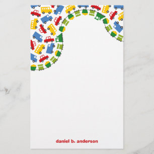 Papelaria O menino do aniversário brinca caminhões colorid
