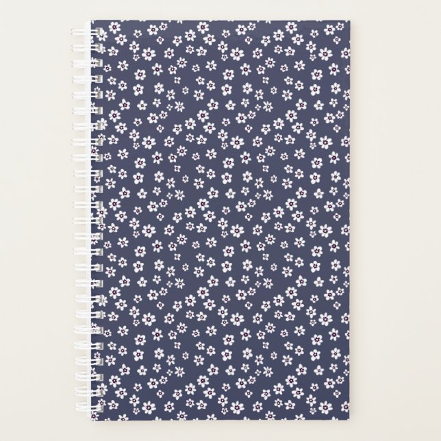 Pequenas flores brancas em um planejador azul (Frente)