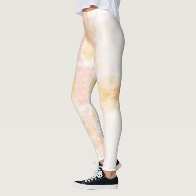 Pessoa vestindo leggings com um pastel suave (Esquerda)