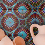 Pétalas Geométricas Simétricas de Azul Vermelho Bu<br><div class="desc">Esse azulejo cerâmico é uma peça de arte cativante, gabando um design intricado e simétrico que lembra flores florescentes ou imagens caleidoscópicas. O design é dominado por formas que se assemelham às pétalas, renderizadas em tons ricos de vermelho burgundo e vibrante. Essas formas são esboçadas com linhas delicadas, adicionando definição...</div>