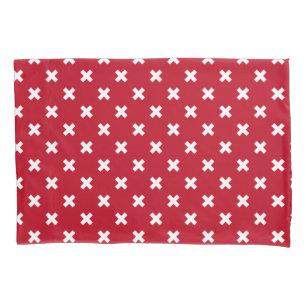 Pontos de cruz brancos em vermelho