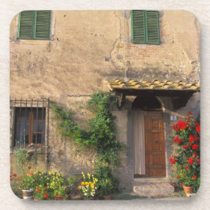 Porta-copo Bela casa antiga com flores em San Gimignano