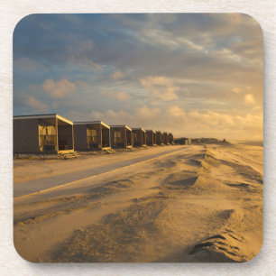 Porta-copo Cabinas de praia no pôr do sol na costa holandesa