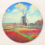Porta-copo De Papel Redondo Monet Tulips Windmill<br><div class="desc">Portas copos com pintura de Claude Monet em flores e moinhos de vento. Lindos e coloridos campos de tulipas vermelhas,  cor-de-rosa e amarelas ao lado de um moinho de vento e casa na Holanda. Um presente de Monet excelente para fãs do impressionismo e da arte francesa.</div>