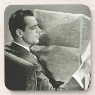 Porta-copo Homem de negócios que lê o jornal