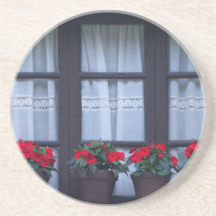 Porta-copos De Arenito Habitação residencial com flores nas janelas