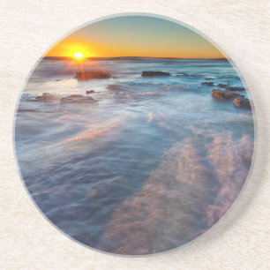 Porta-copos De Arenito Raios de sol iluminam o Oceano Pacífico