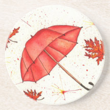 Guarda-chuva vermelha brilhante e folhas vermelhas