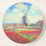 Porta-copos Monet Tulips Windmill<br><div class="desc">Porta copos de arenito com pintura de Claude Monet em flores e moinhos. Lindos e coloridos campos de tulipas vermelhas,  cor-de-rosa e amarelas ao lado de um moinho de vento e casa na Holanda. Um presente de Monet excelente para fãs do impressionismo e da arte francesa.</div>