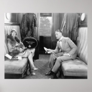 Poster Couple sitting together in a compartment of a trai
