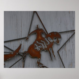 Poster Escultura de metal de vaqueiro em bronco de balanç