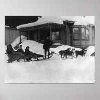 Family traveling by Dog Sled in Alaska