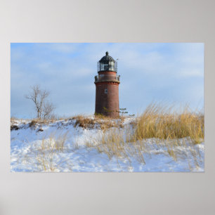 Poster Farol resistente numa costa rochosa no inverno