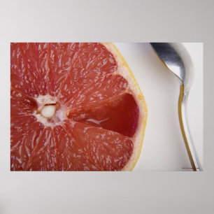 Poster Fim-acima de uma fatia de laranja e de uma colher