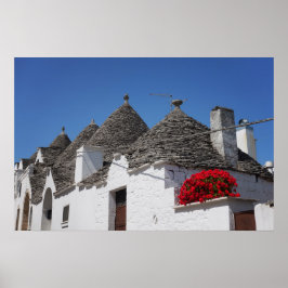 Poster Flores de gerânio e casas de trulli em Alberobello