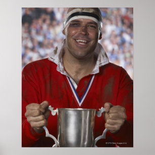 Pôster Jogador do rugby que guardara o copo do troféu,