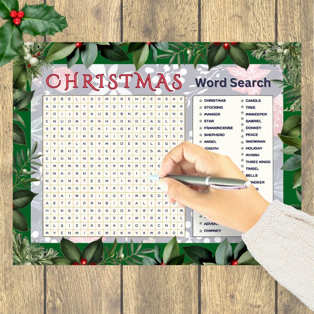 Poster Quebra-cabeça de busca de palavras de Natal Ativid (A festive Christmas word search poster with greenery border)