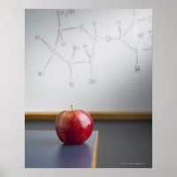 Red apple sitting on teachers desk