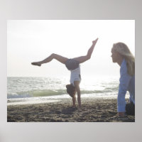 Teenage girl performs gymnastic feat, mom