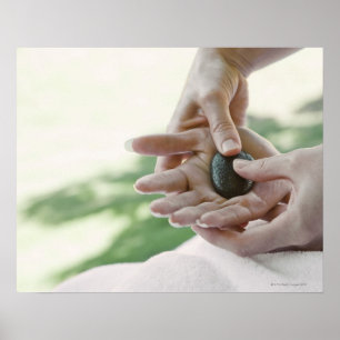 Pôster Woman getting hand massage with hot stone