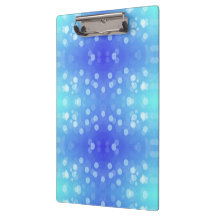 prancheta com um padrão bokeh azul e verde-azulado