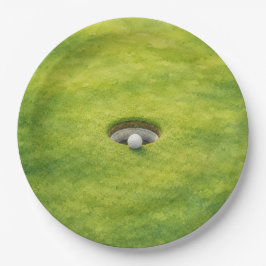 Prato De Papel Bola de golfe está ao lado do buraco no green