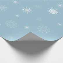Flocos de neve no papel de envolvimento azul