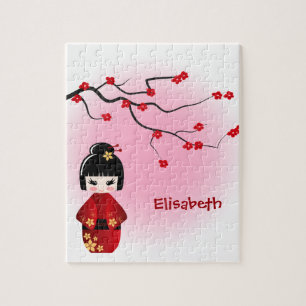Quebra-cabeça Boneca japonesa do kokeshi nas flores de sakura