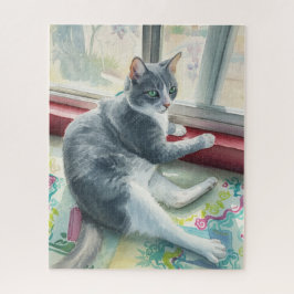 Quebra-cabeça do gato sentado junto à janela