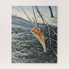 Quebra-cabeça Folha Congelada acima de um Fluxo de Neve