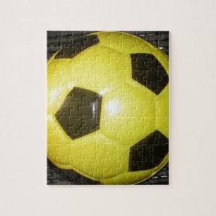 Quebra-cabeça Futebol amarelo e preto.