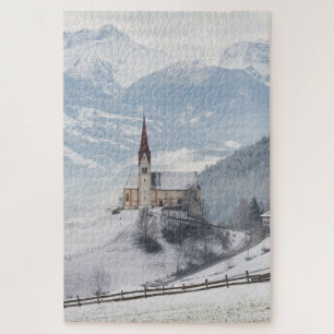 Quebra-cabeça Igreja em uma paisagem alpina do inverno