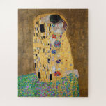 Quebra-cabeça O Beijo de Gustav Klimt<br><div class="desc">O Beijo de Gustav Klimt O Beijo é uma pintura de óleo na canvas com folhas de ouro, prata e platina adicionadas pelo pintor simbolista austríaco Gustav Klimt. Ela foi pintada em algum ponto em 1907 e 1908, no auge do que os estudiosos chamam de "Período Ouro". Apresentando tonalidades de...</div>