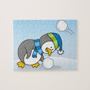 Quebra-cabeça Pequeno pinguim pegando uma bola de neve