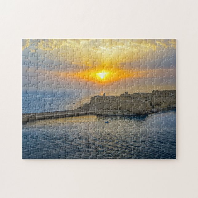 Quebra-cabeça Pôr do sol no porto de Malta. (Horizontal)