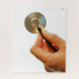 Quebra-cabeça Stethoscoop in een hand voor een ziekenhuis sfeer.