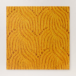 Quebra-cabeça Suéter de malha laranja, fundo texturizado.