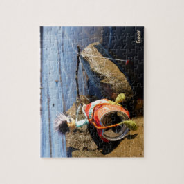 Quebra-cabeça Vissende Fubby op een blikje aan de waterkant.