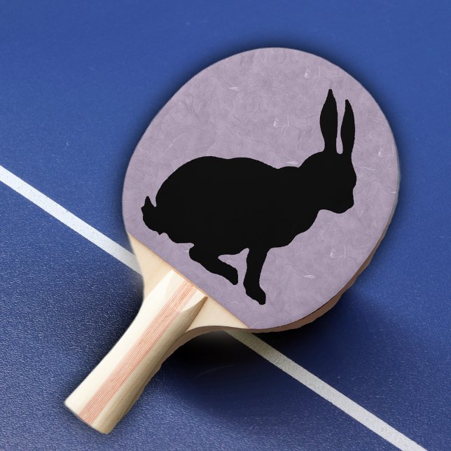 Raquete De Ping Pong Coelho Negro Silhout Páscoa (Black silhouette sitting rabbit on purple marble look background on ping pong paddle.)