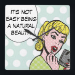 Relógio de Parede de BD de Beleza Natural<br><div class="desc">Este relógio de parede balnear certamente trará um sorriso aos seus lábios. O Relógio de Beleza Natural do Livro apresenta uma linda jovem aplicando batom vermelho e uma bolha de fala que diz, "Não é fácil ser uma beleza natural." A garota e a bolha de fala estão em azul de...</div>