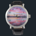 Relógio De Pulso Paisagem Cêntrica Rosa<br><div class="desc">Belo pôr do sol rosa sobre um lago calmo com uma fila de árvores no fundo. Uma mistura e mistura adoráveis de nuvens coloridas que incluem rosa,  azul,  roxo e amarelo. Iluminação incrível e moderna,  sombras e reflexões.</div>