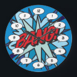 Relógio Grande CQ Book Pop Art BANG<br><div class="desc">Tendência divertida, pop de quadrinhos super-heróis que certamente adicionarão um splash de cor a uma variedade de salas em sua casa ou escritório. Uma maneira ideal de se tratar a si mesmo ou a alguém que você conhece com estes relógios de desenhista legal e únicos. Por que não adicionar um...</div>