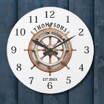 Relógio Grande Monograma de Design de roda do navio náutico<br><div class="desc">Design Monograma de Roda Marinha Náutica com Barramento Marítimo Grande Relógio Nome ou monograma Personalizado de Família ou Relógio Grande com Relógio Marítimo Nacional Monograma de Roda Marinha Grande Relógio em design de estilo náutico com face numérica árabe num design de fundo de roda de barco. Presente perfeito para recém-casados,...</div>
