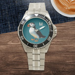Relógio Monograma de aves do mar de espécies selvagens da<br><div class="desc">Aproveite o charme do Puffin Atlântico com este relógio elegante. Apresentando uma ilustração do adorável conjunto de aves marinhas contra um fundo azul-oceano, este relógio é perfeito para qualquer pessoa que procura um na moda, design inspirado na natureza. A face de observação pode ser personalizada com o seu monograma inicial,...</div>
