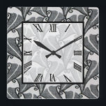 Relógio Quadrado Art Deco Folaves<br><div class="desc">10, 75" x 10, 75" de relógio na parede acrílica com uma imagem de um belo design preto e branco da Art Deco. O quadrado branco transparente tem uma face do relógio numérico romano e uma borda preta. Veja toda a coleção Roaring 20s Clock no DECOR | Seção Relógios.</div>